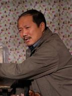 謝廣坤（唐鑒軍飾演）